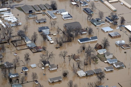 Aerial view of residential area submergeg in flood watres.