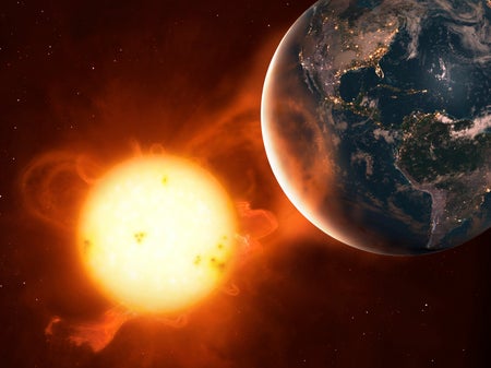 Illustration of a coronal mass ejection impacting the Earth's atmosphere