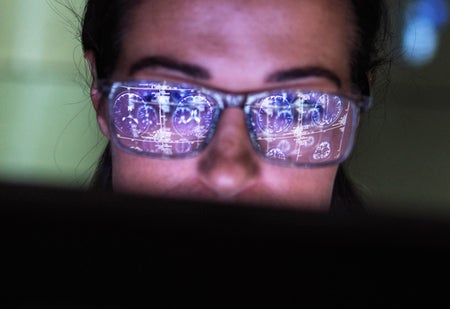 Doctor viewing a patient's brain scan on a screen