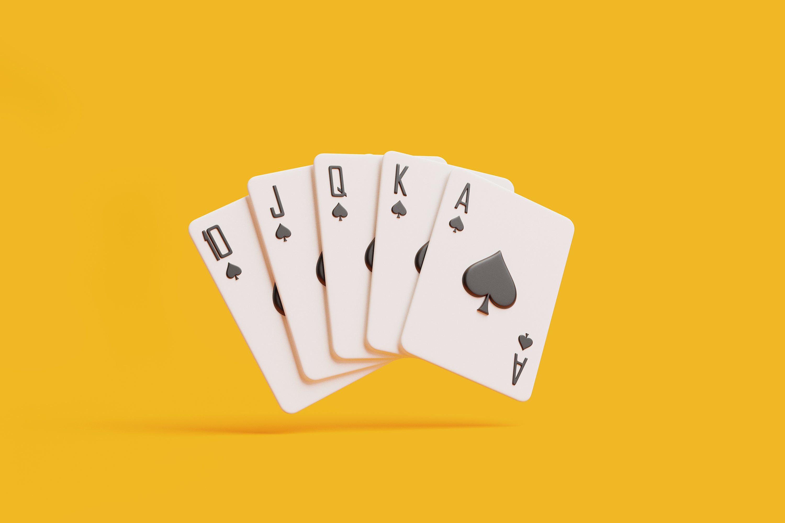 Perfect spade royal flush playing cards spread on a vivid orange background.