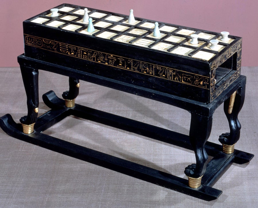 A game of Senet in ebony and ivory.